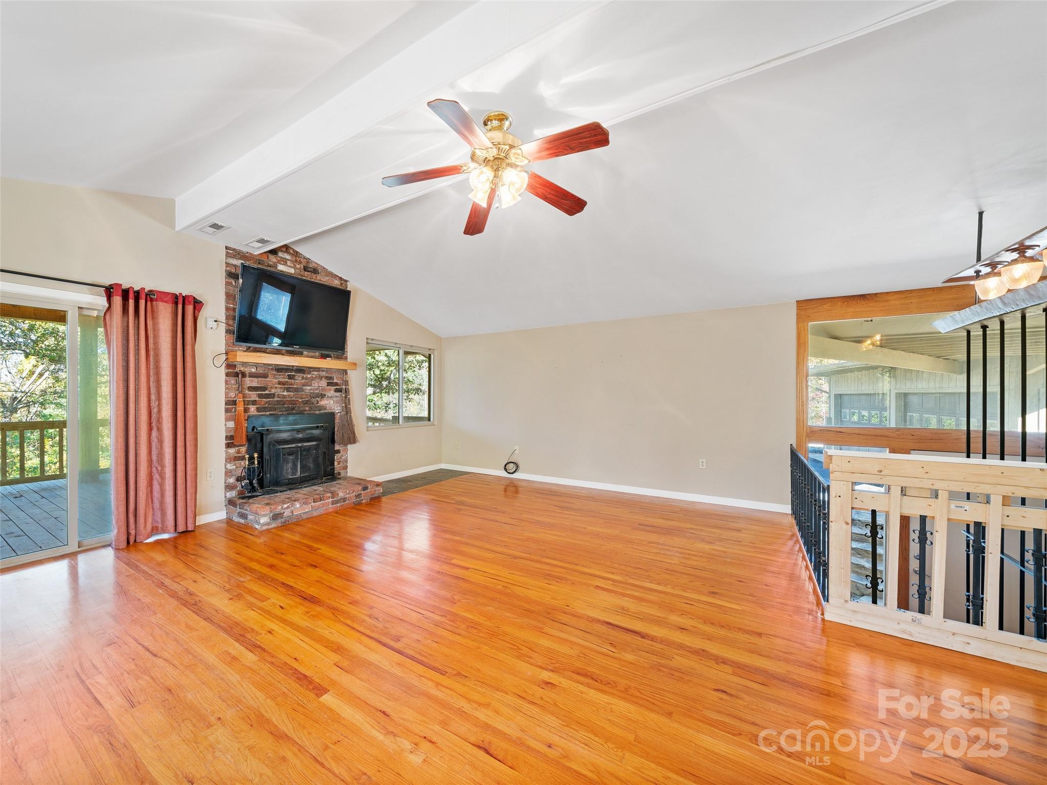 19 Old Patton Hill Road Swannanoa, NC 28778 - Photo 10 of 44 a view of an empty room with window and wooden floor