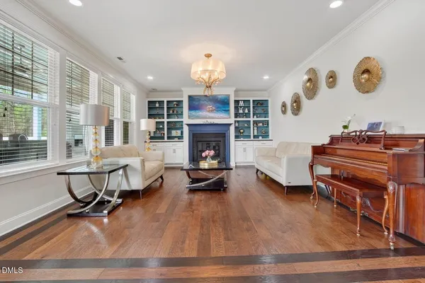 a kitchen with granite countertop white cabinets and a stove top oven