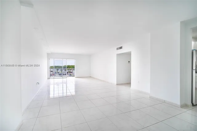 a view of an empty room and window