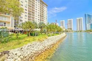 a view of swimming pool with outdoor seating and plants