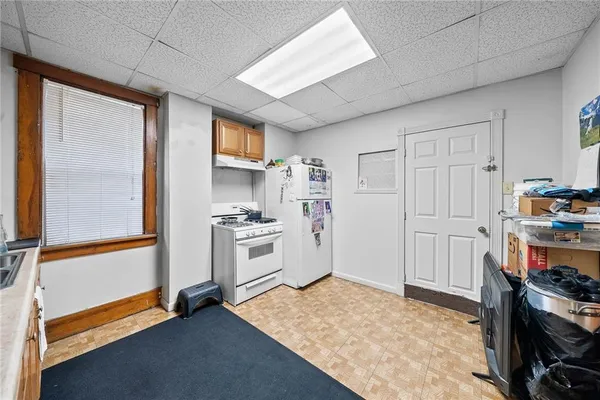 a kitchen with stainless steel appliances granite countertop a stove and a refrigerator