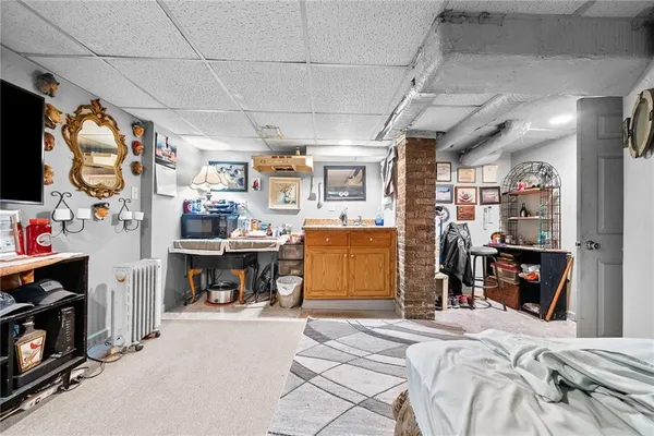 a bed room with a bed and a television