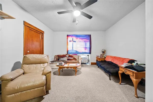 a bedroom with furniture and a chandelier