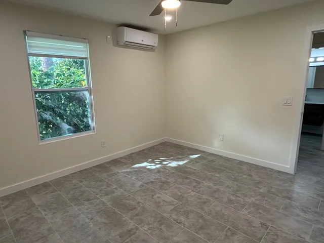 an empty room with a empty space and a window