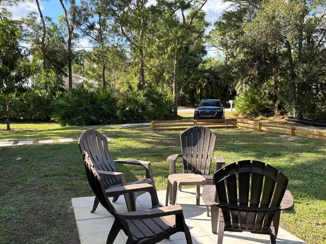 a view of a chairs and table in the patio