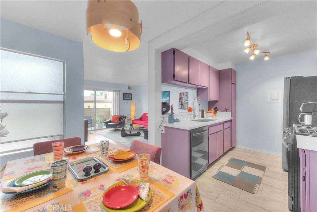 6351 Riverside Drive, Unit 69 Chino, CA 91710 - Photo 5 of 21 a open kitchen with stainless steel appliances granite countertop a stove refrigerator and cabinets