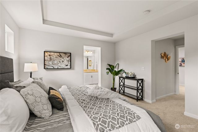 a bedroom with a bed and a couch