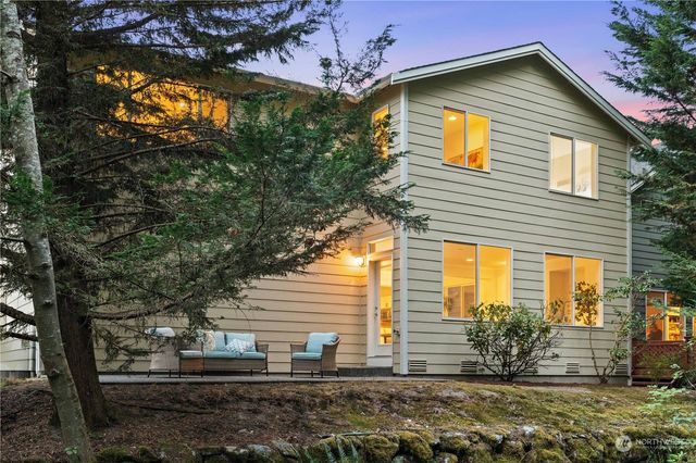 a view of house with backyard