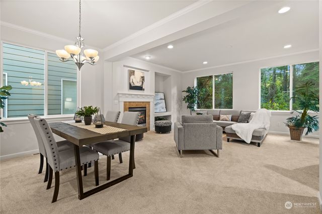 a view of a livingroom with furniture and a chandelier