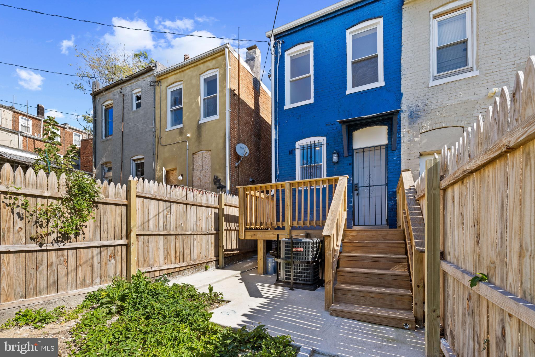 6 South Payson Street Baltimore, MD 21223 - Photo 17 of 17 a view of a house with wooden fence