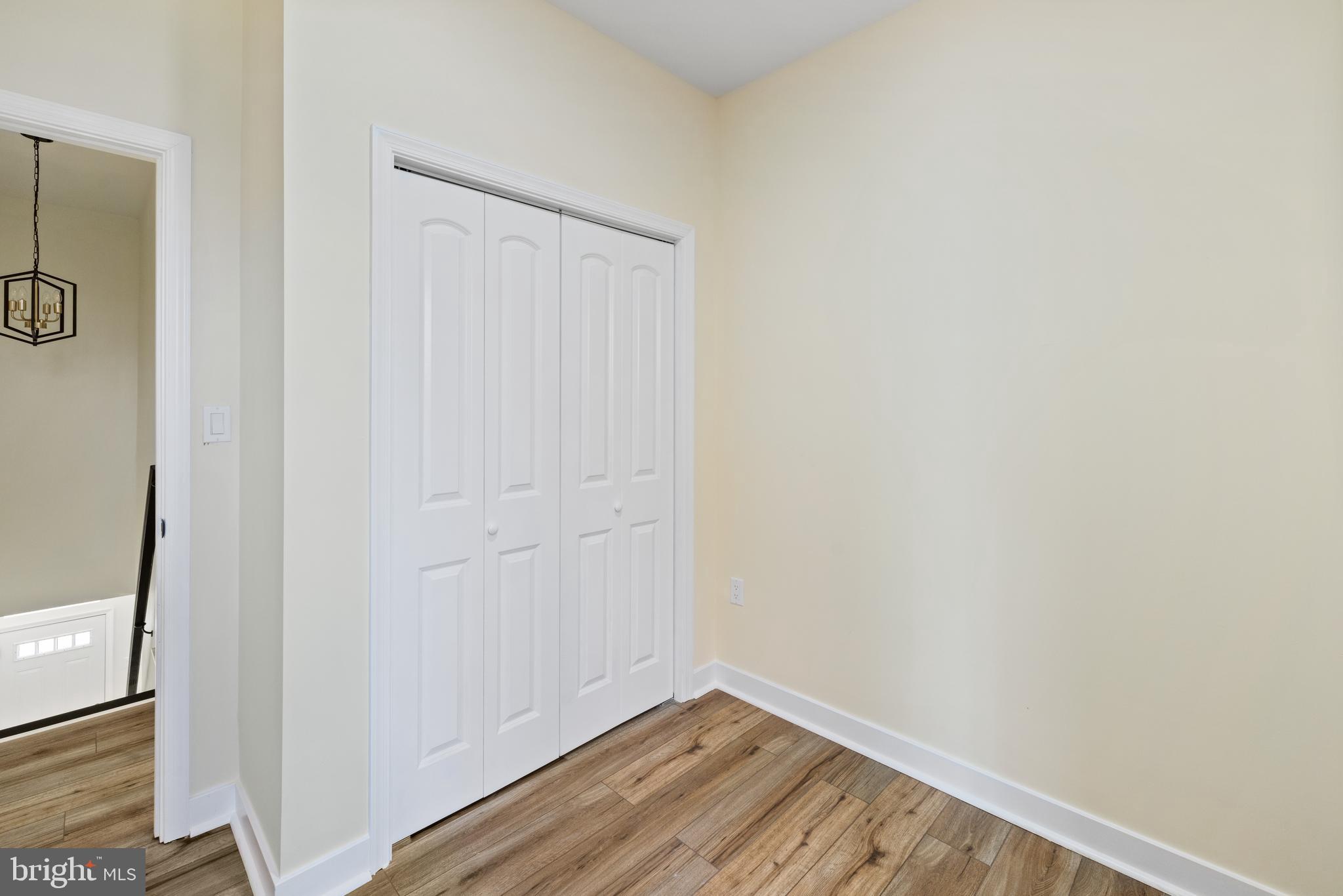 6 South Payson Street Baltimore, MD 21223 - Photo 6 of 17 a view of a small space with wooden floor and a window