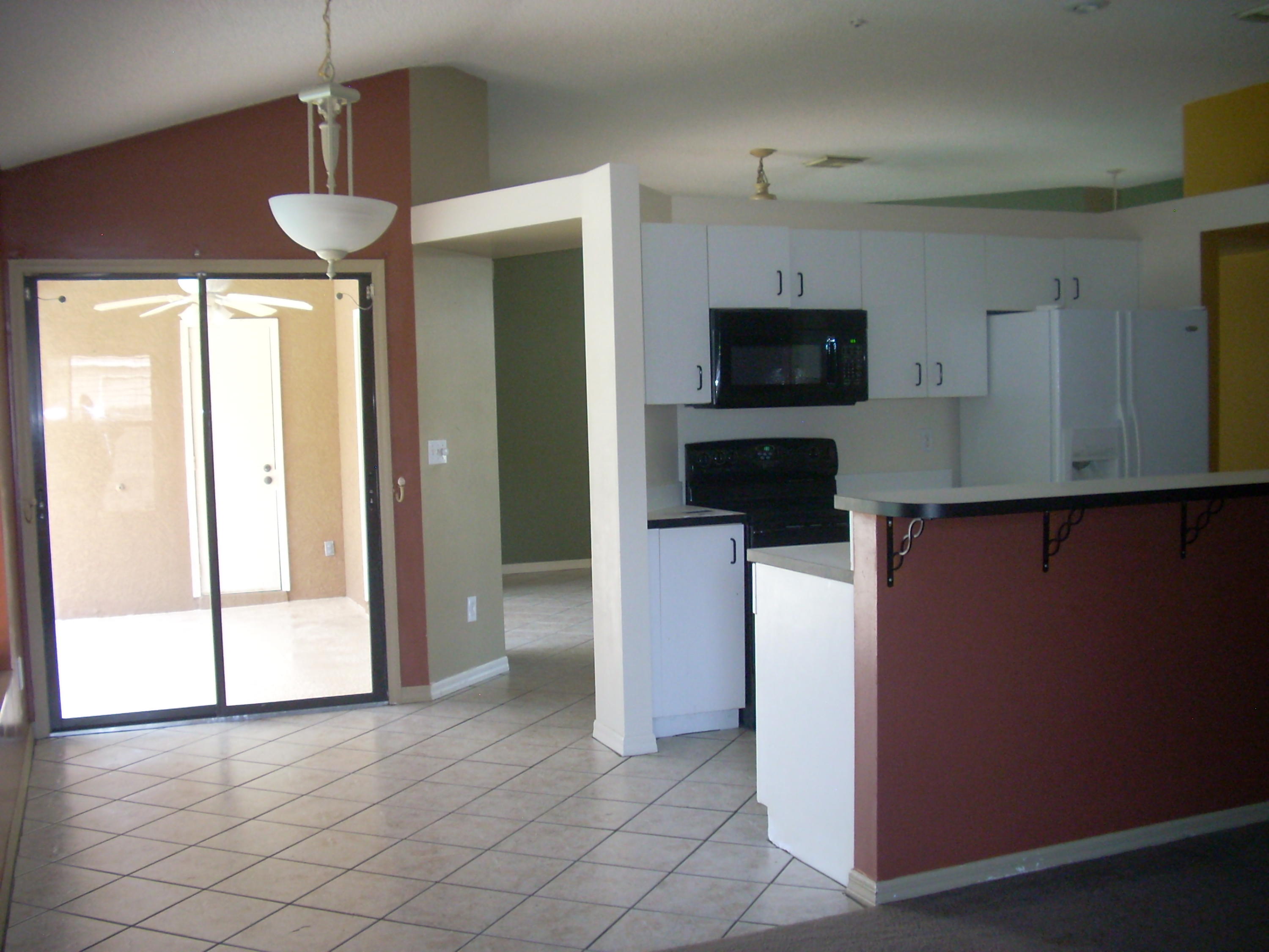 422 Southwest Ridgecrest Drive Port St. Lucie, FL 34953 - Photo 6 of 35 View of kitchen from familyroom