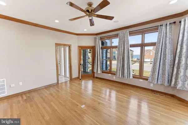 a living room filled with furniture and a large window