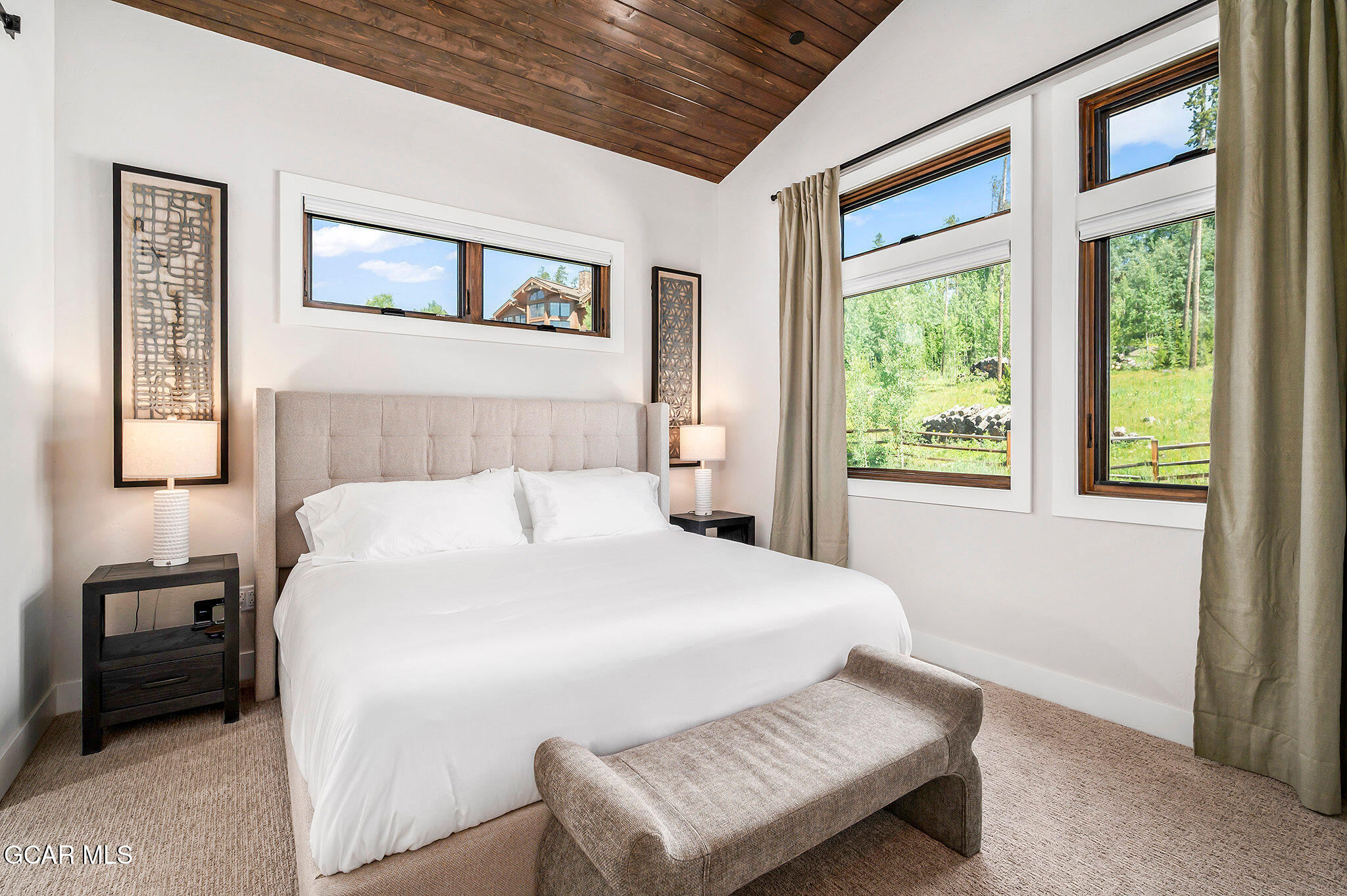 82 Game Trail Fraser, CO 80442 - Photo 18 of 51 a bedroom with a bed next to a window