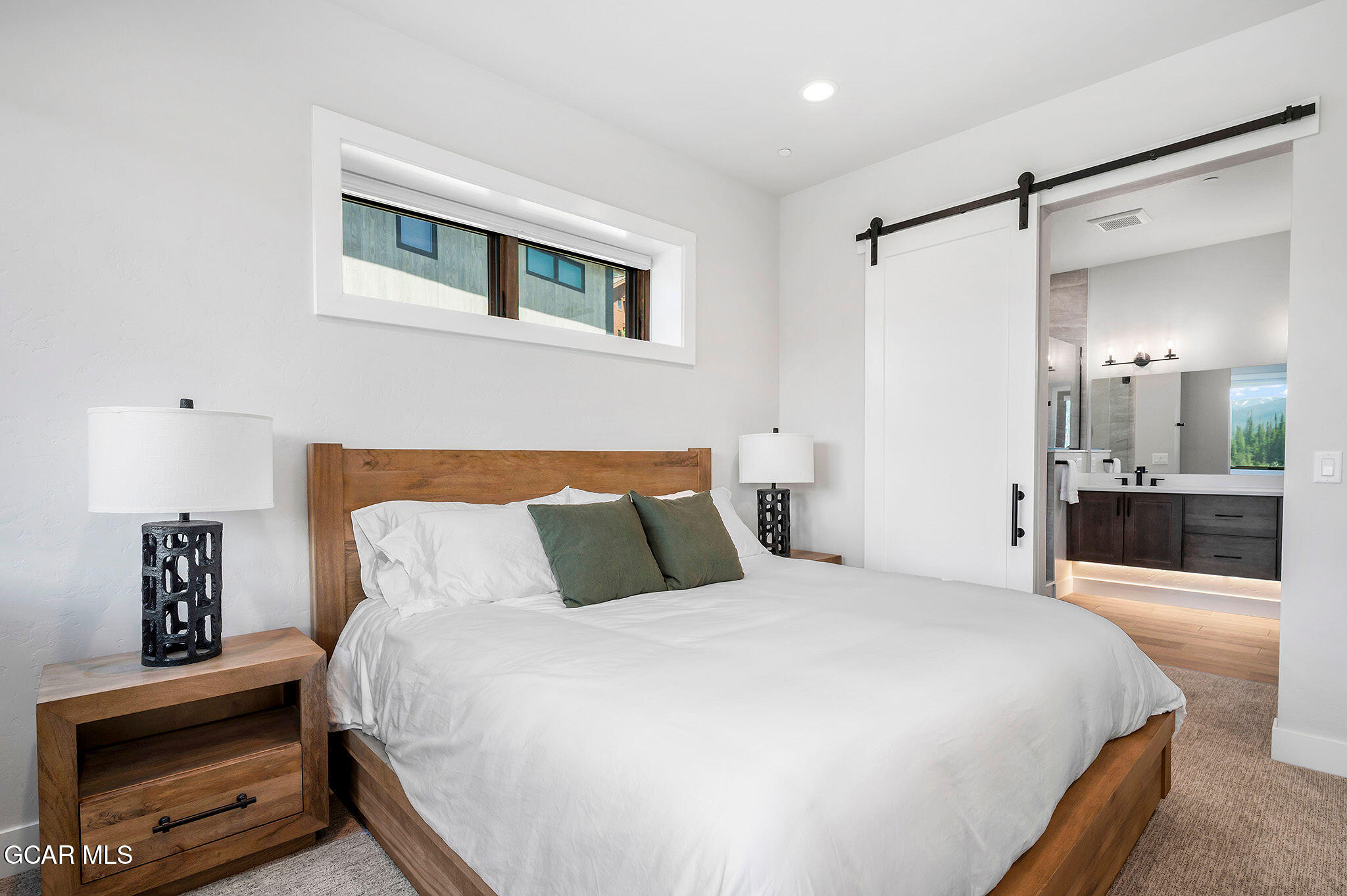 82 Game Trail Fraser, CO 80442 - Photo 28 of 51 a bedroom with a bed and a view of bathroom