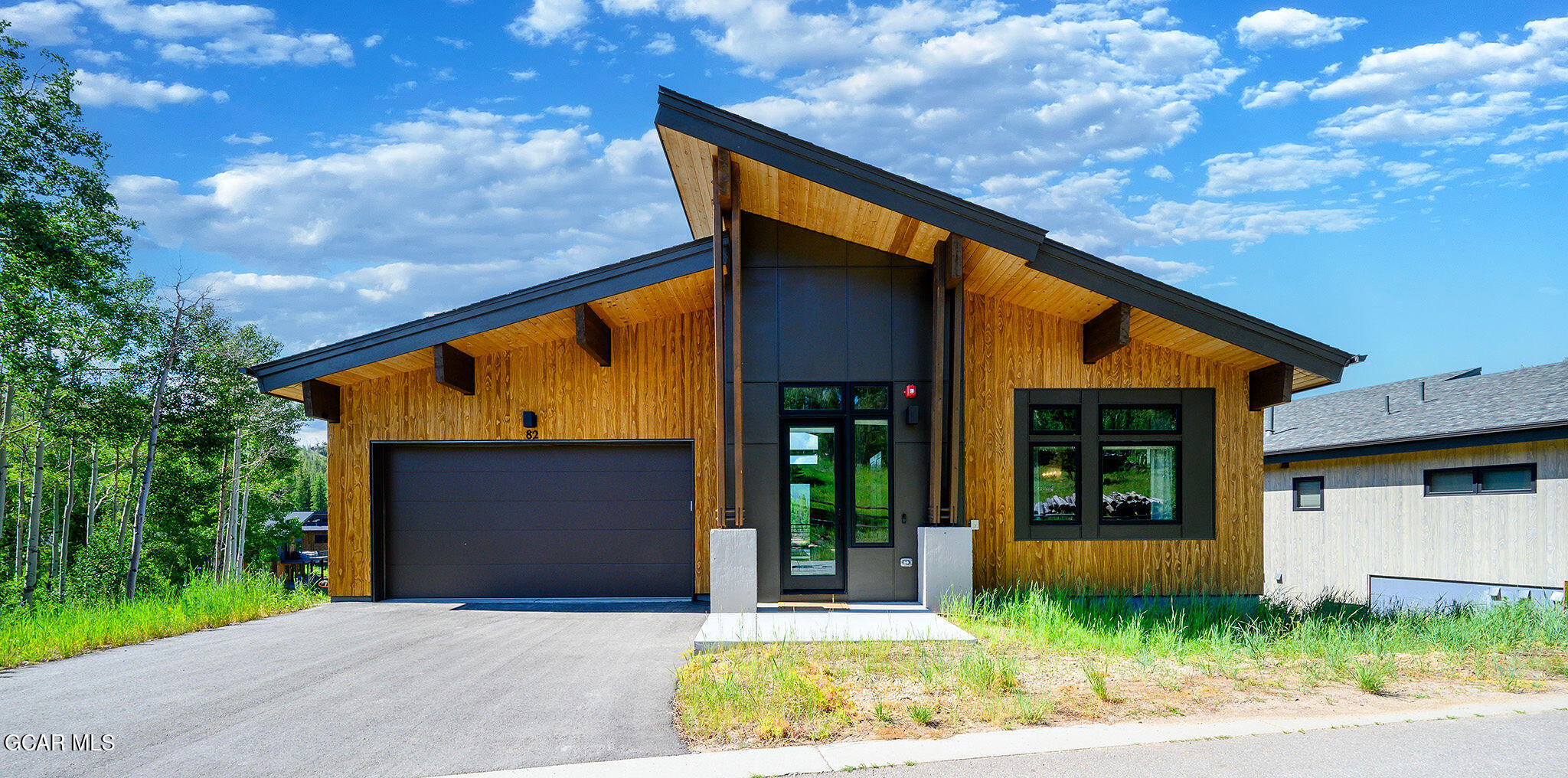 82 Game Trail Fraser, CO 80442 - Photo 37 of 51 a front view of a house with a yard and potted plants