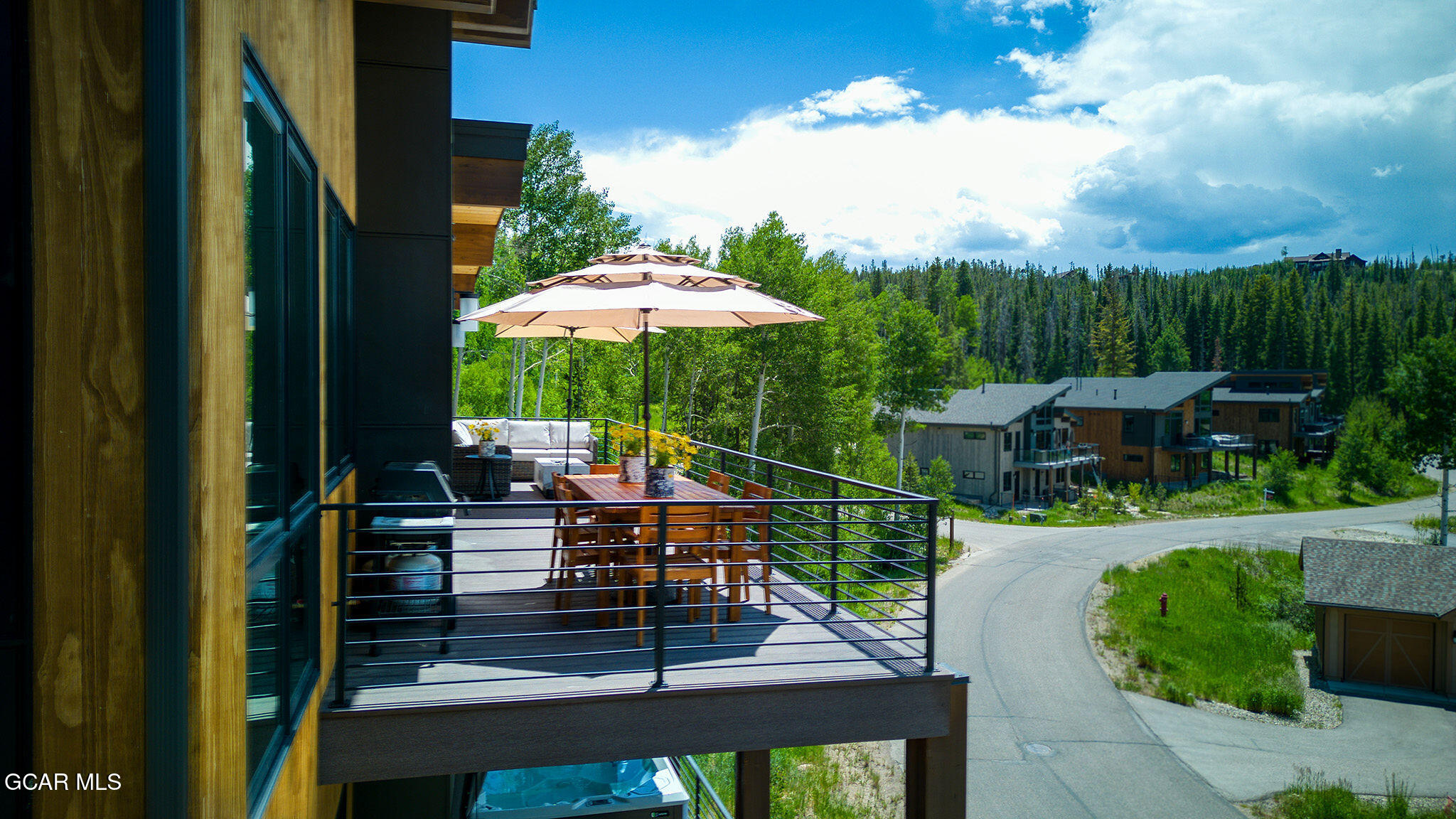 82 Game Trail Fraser, CO 80442 - Photo 49 of 51 a view of a chairs and table in the patio with a fire pit