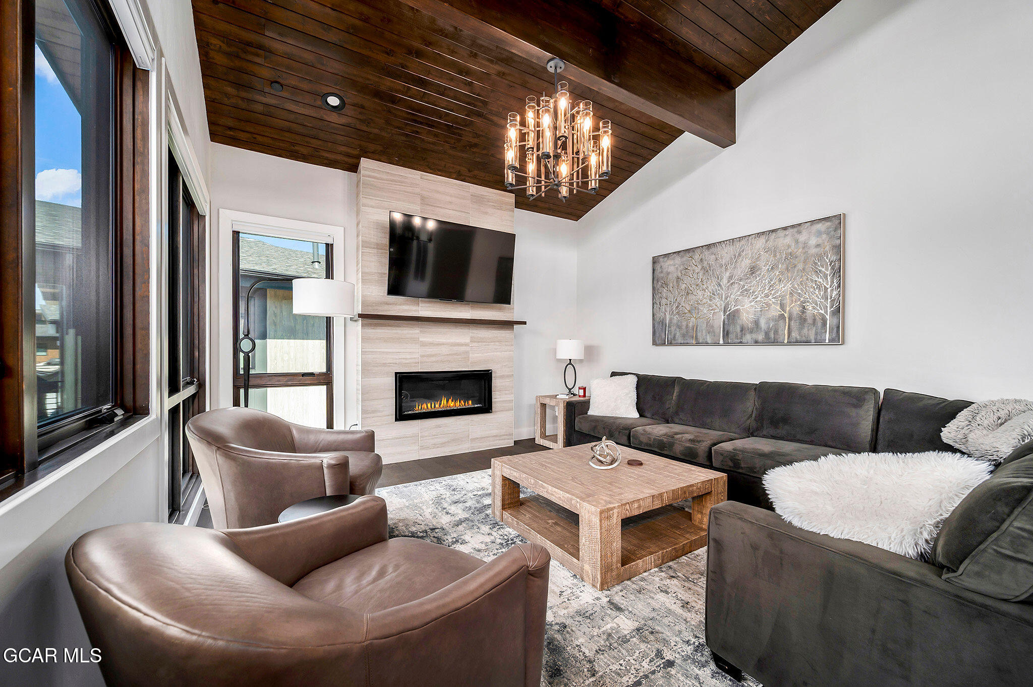 82 Game Trail Fraser, CO 80442 - Photo 5 of 51 a living room with furniture a flat screen tv and a fireplace