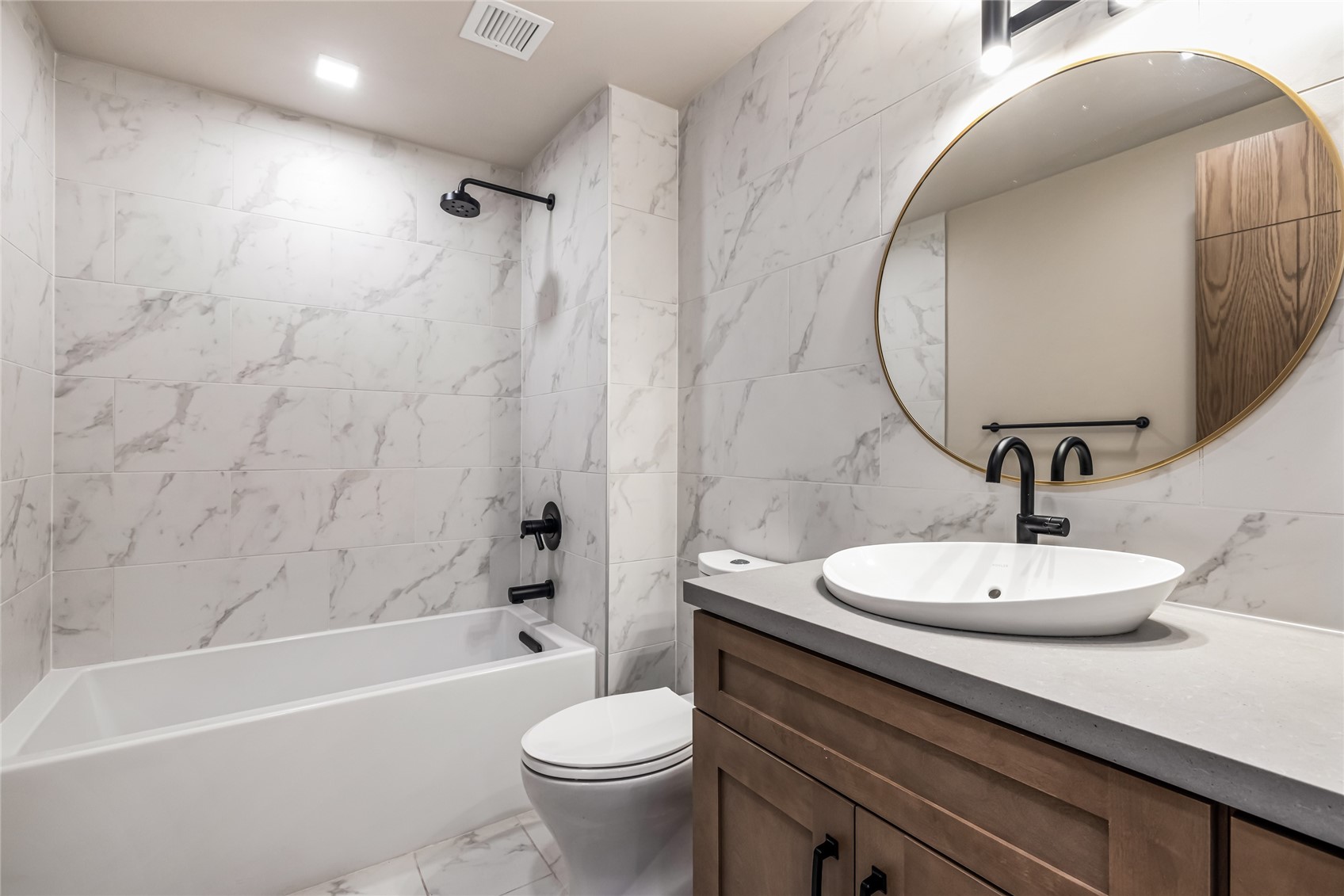 80 West Main Street, Unit 305 Frisco, CO 80443 - Photo 14 of 46 a bathroom with a sink a toilet and a mirror