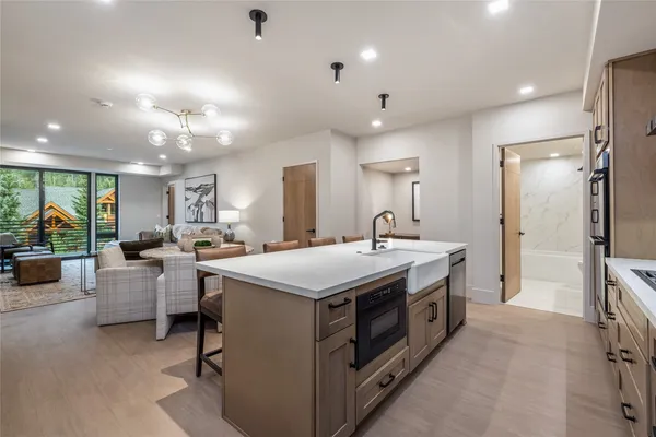 a kitchen with stove and refrigerator