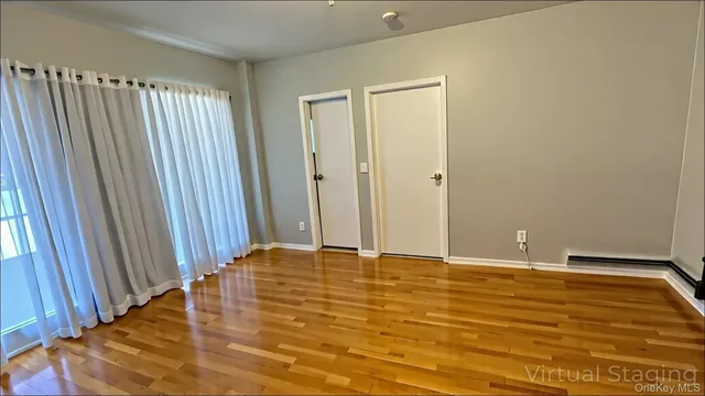 a view of room with window and a bathroom