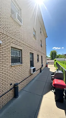 a view of a patio with table and chairs