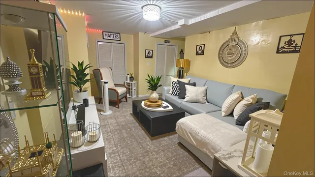 a living room with furniture and a clock