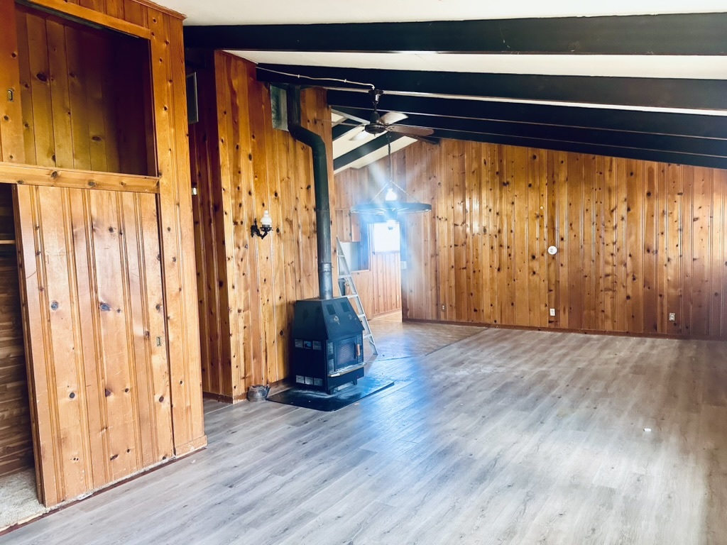 1111 North Bell Avenue Pontiac, IL 61764 - Photo 10 of 35 a view of empty room with wooden floor and fan