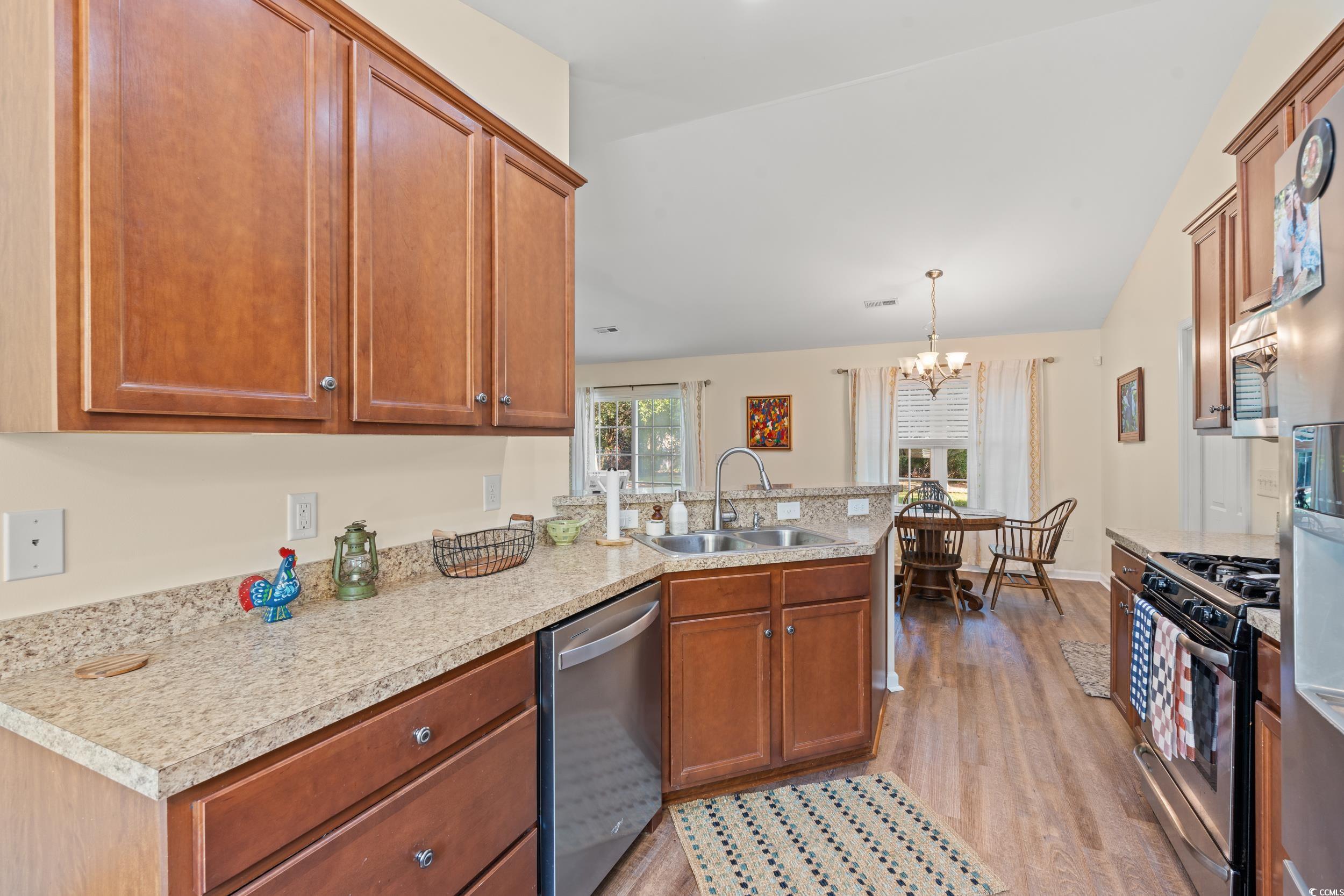1208 10th Avenue Conway, SC 29526 - Photo 11 of 34 Kitchen featuring a chandelier, light wood-type fl