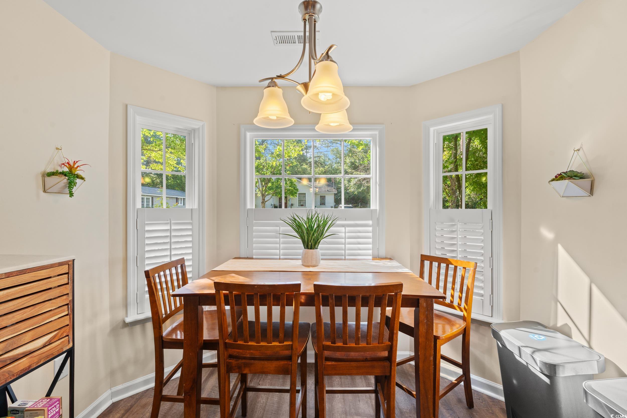1208 10th Avenue Conway, SC 29526 - Photo 12 of 34 Dining room with a chandelier, wood-type flooring,