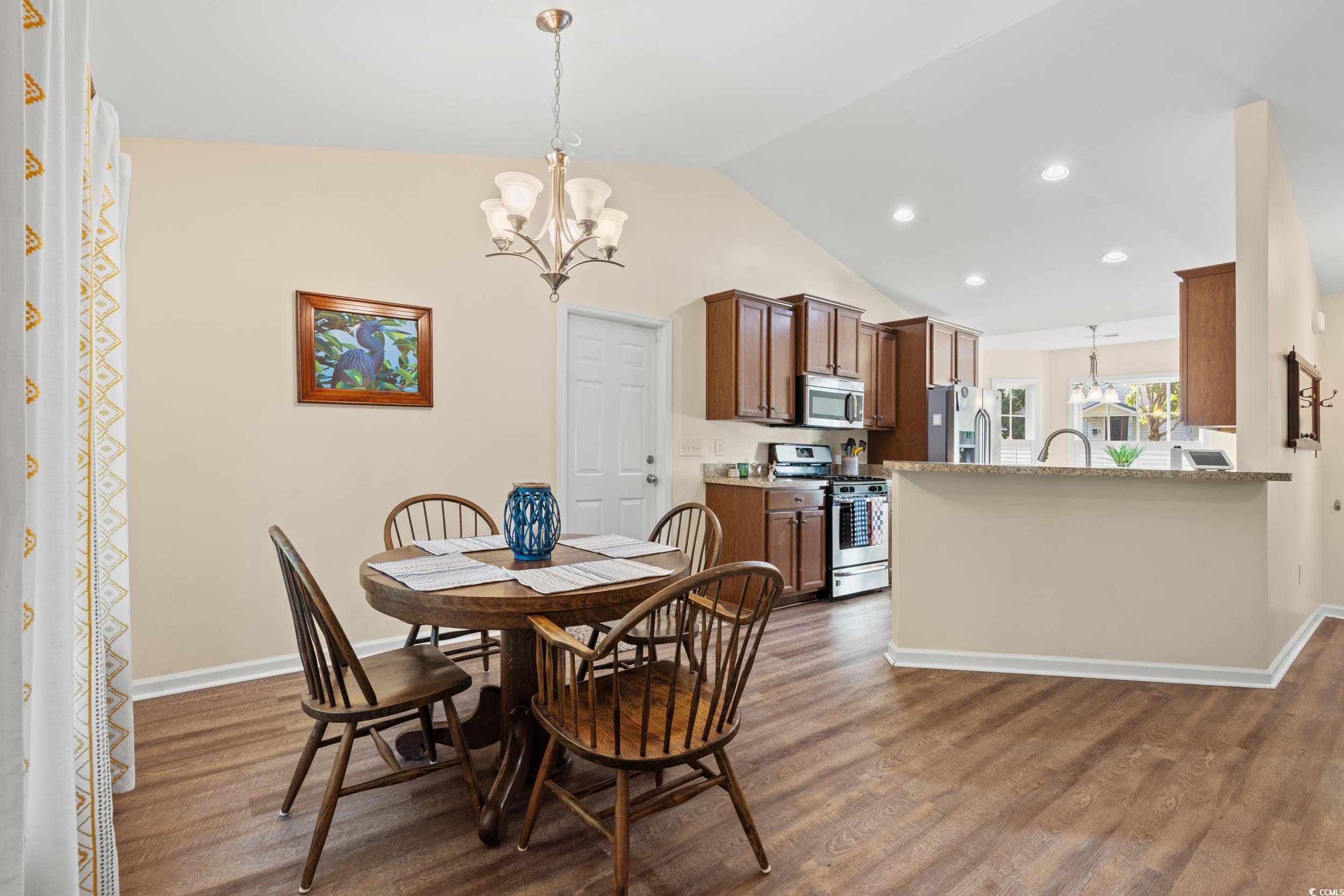 1208 10th Avenue Conway, SC 29526 - Photo 7 of 34 Dining room featuring an inviting chandelier, wood
