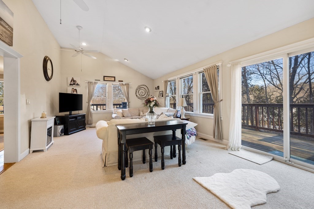 18 Harris Street Clinton, MA 01510 - Photo 11 of 31 a living room with furniture a flat screen tv and a large window
