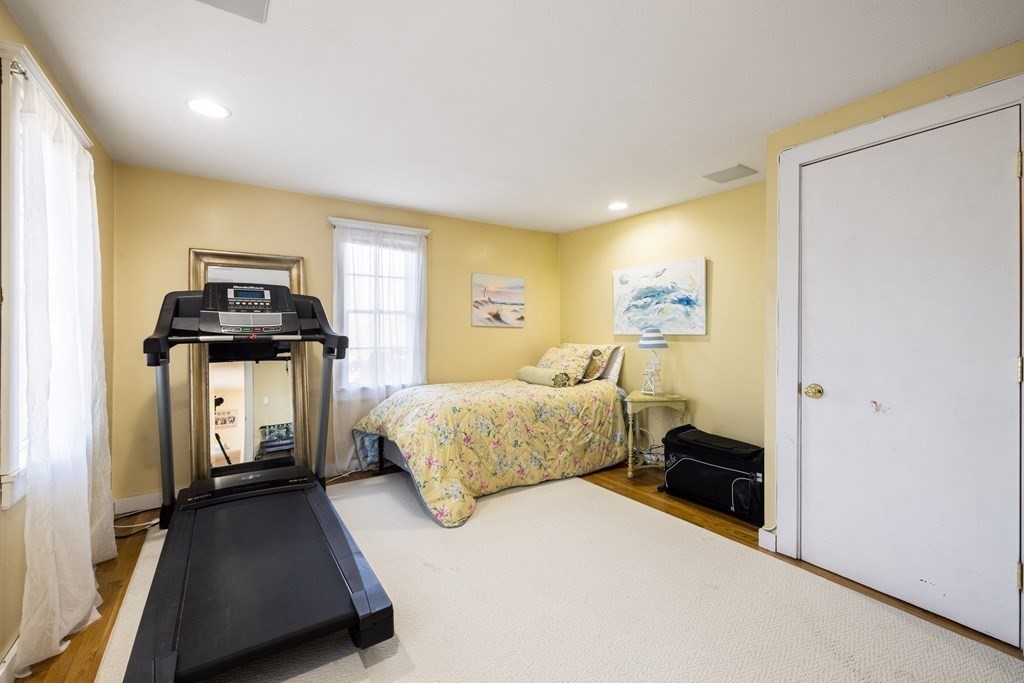 18 Harris Street Clinton, MA 01510 - Photo 16 of 31 a bedroom with a bed and wooden floor