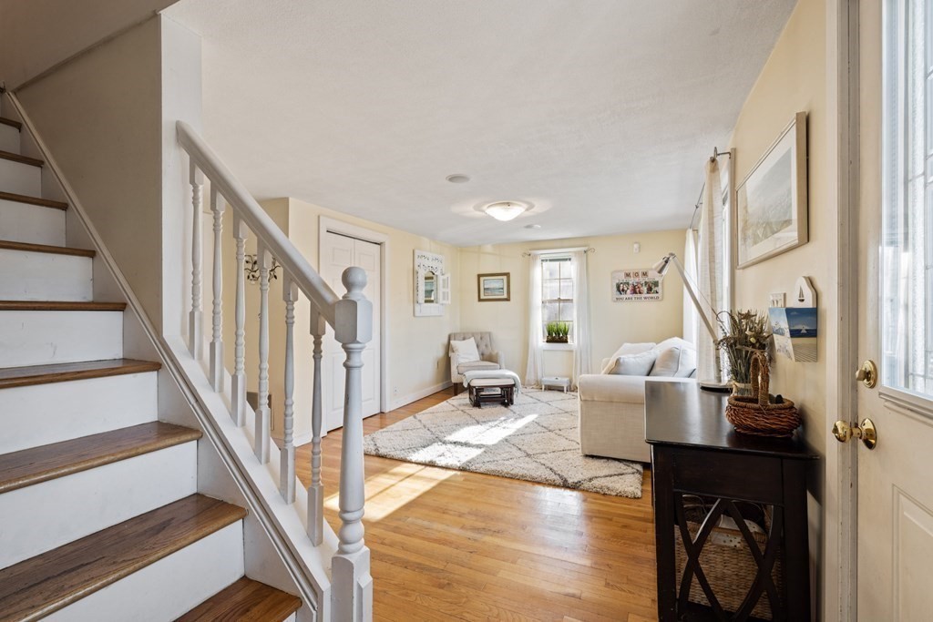 18 Harris Street Clinton, MA 01510 - Photo 17 of 31 a living room with furniture and a wooden floor