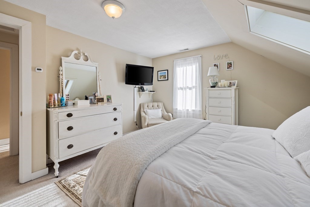 18 Harris Street Clinton, MA 01510 - Photo 19 of 31 a bedroom with a bed and a flat tv screen on dresser