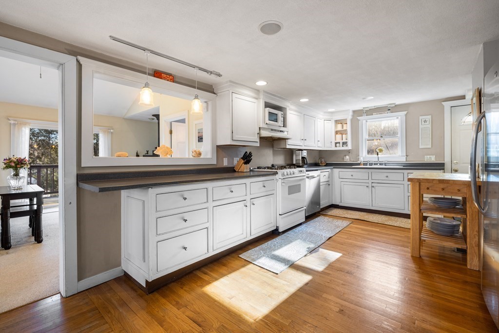 18 Harris Street Clinton, MA 01510 - Photo 2 of 31 a large kitchen with cabinets