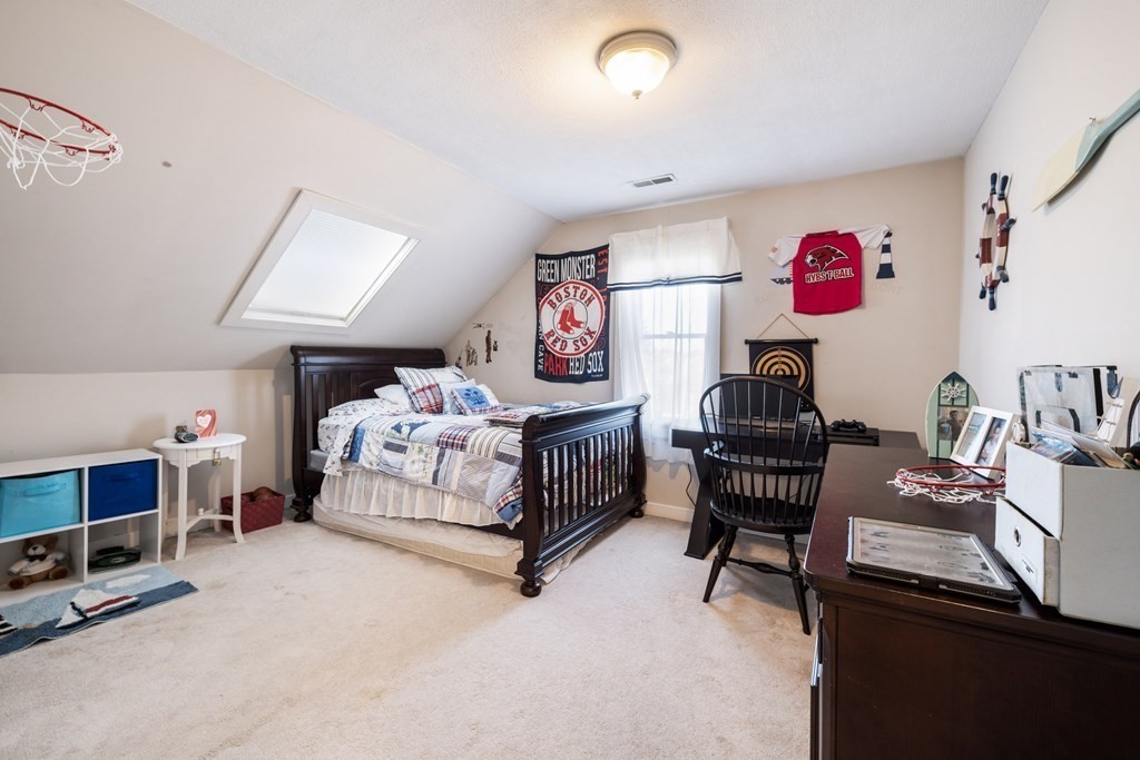 18 Harris Street Clinton, MA 01510 - Photo 22 of 31 a bedroom with furniture and a bed