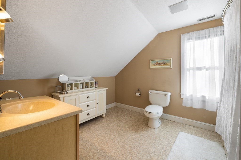 18 Harris Street Clinton, MA 01510 - Photo 23 of 31 a bathroom with a sink toilet and window