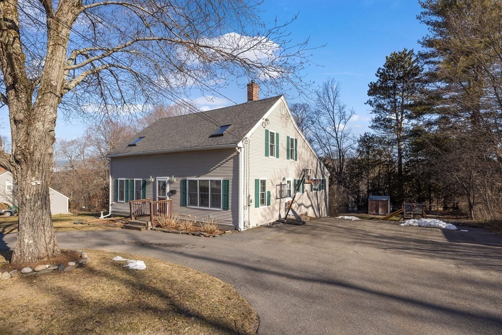 18 Harris Street Clinton, MA 01510 - Photo 26 of 31 a view of a white house with a large tree