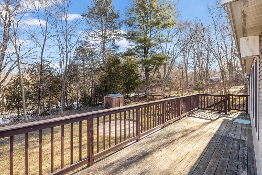 18 Harris Street Clinton, MA 01510 - Photo 31 of 31 a view of balcony with wooden floor and fence