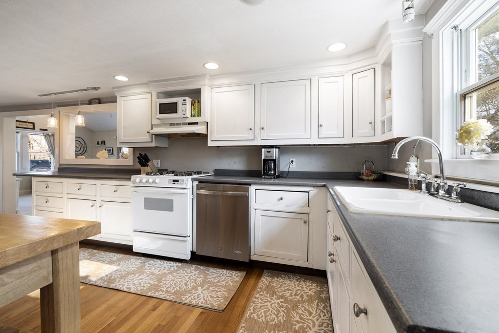 18 Harris Street Clinton, MA 01510 - Photo 4 of 31 a kitchen with granite countertop a sink stainless steel appliances and cabinets