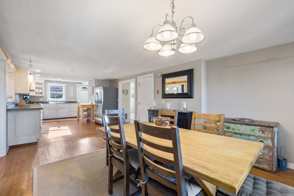 18 Harris Street Clinton, MA 01510 - Photo 7 of 31 a view of a dining room with furniture and wooden floor