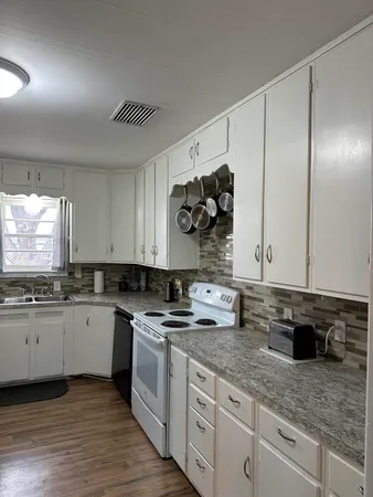 a kitchen with a sink and cabinets