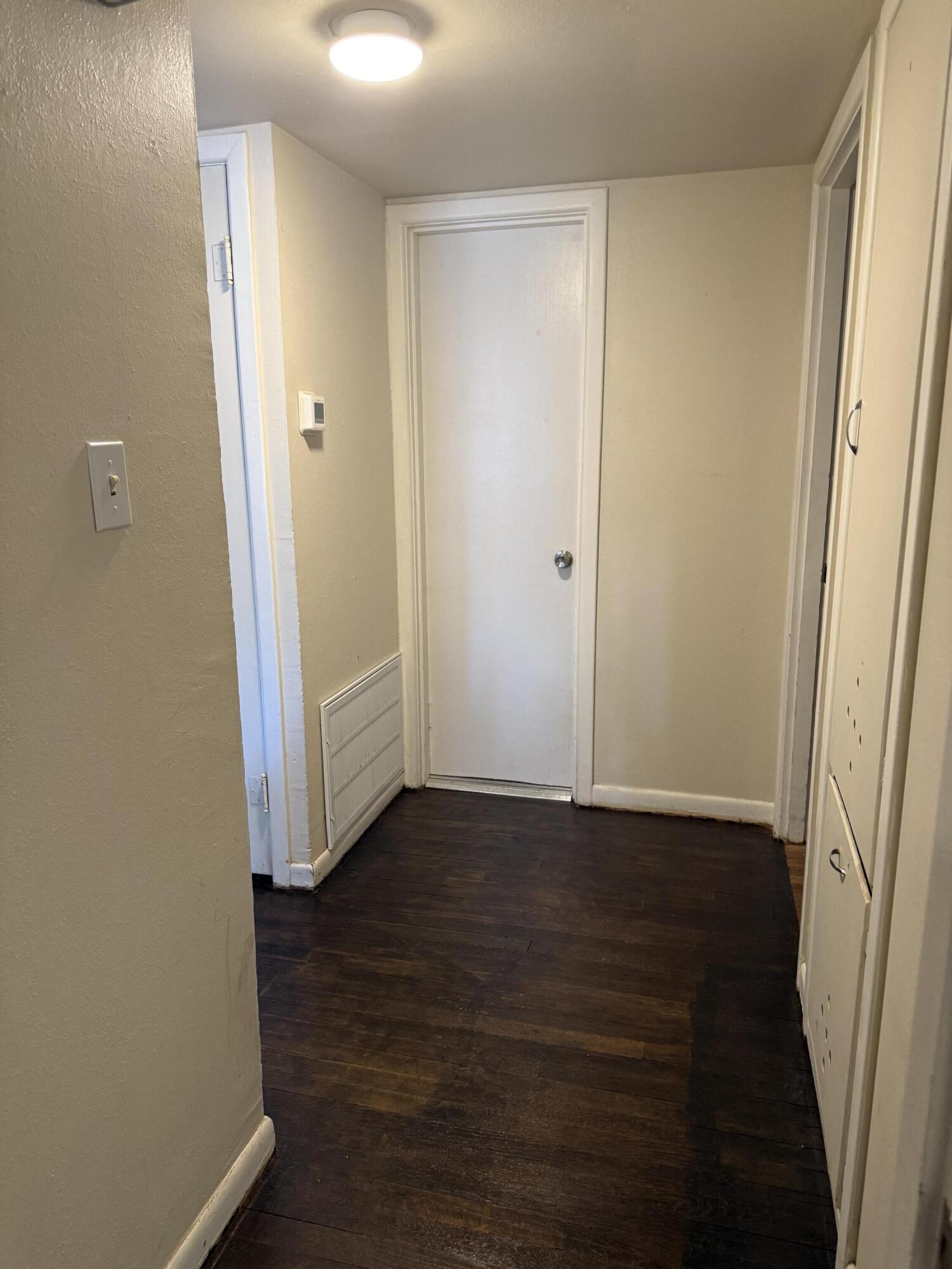 1907 38th Street Lubbock, TX 79412 - Photo 32 of 36 a view of an empty room with wooden floor