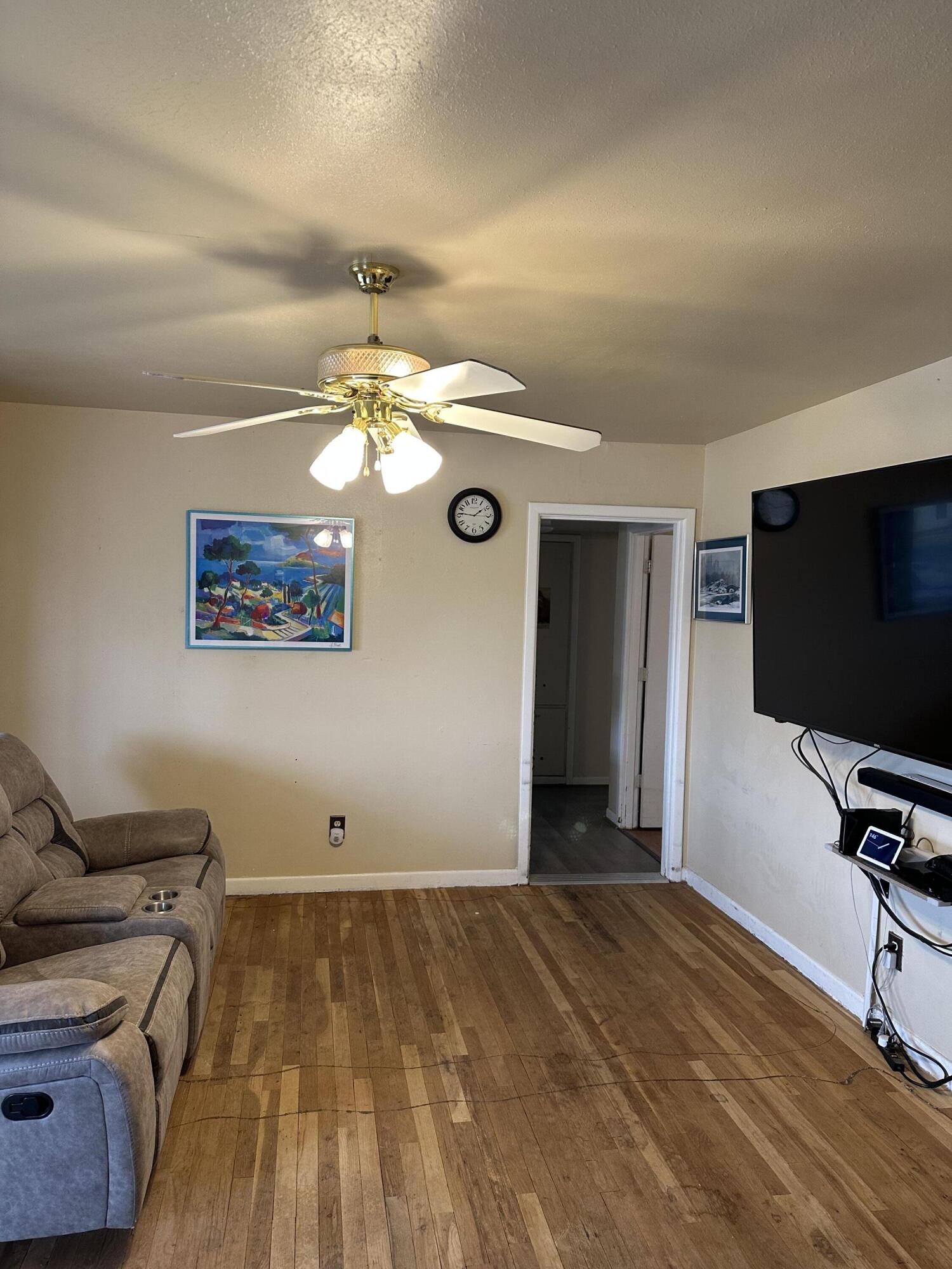 1907 38th Street Lubbock, TX 79412 - Photo 5 of 36 a view of a livingroom with furniture and a flat screen tv