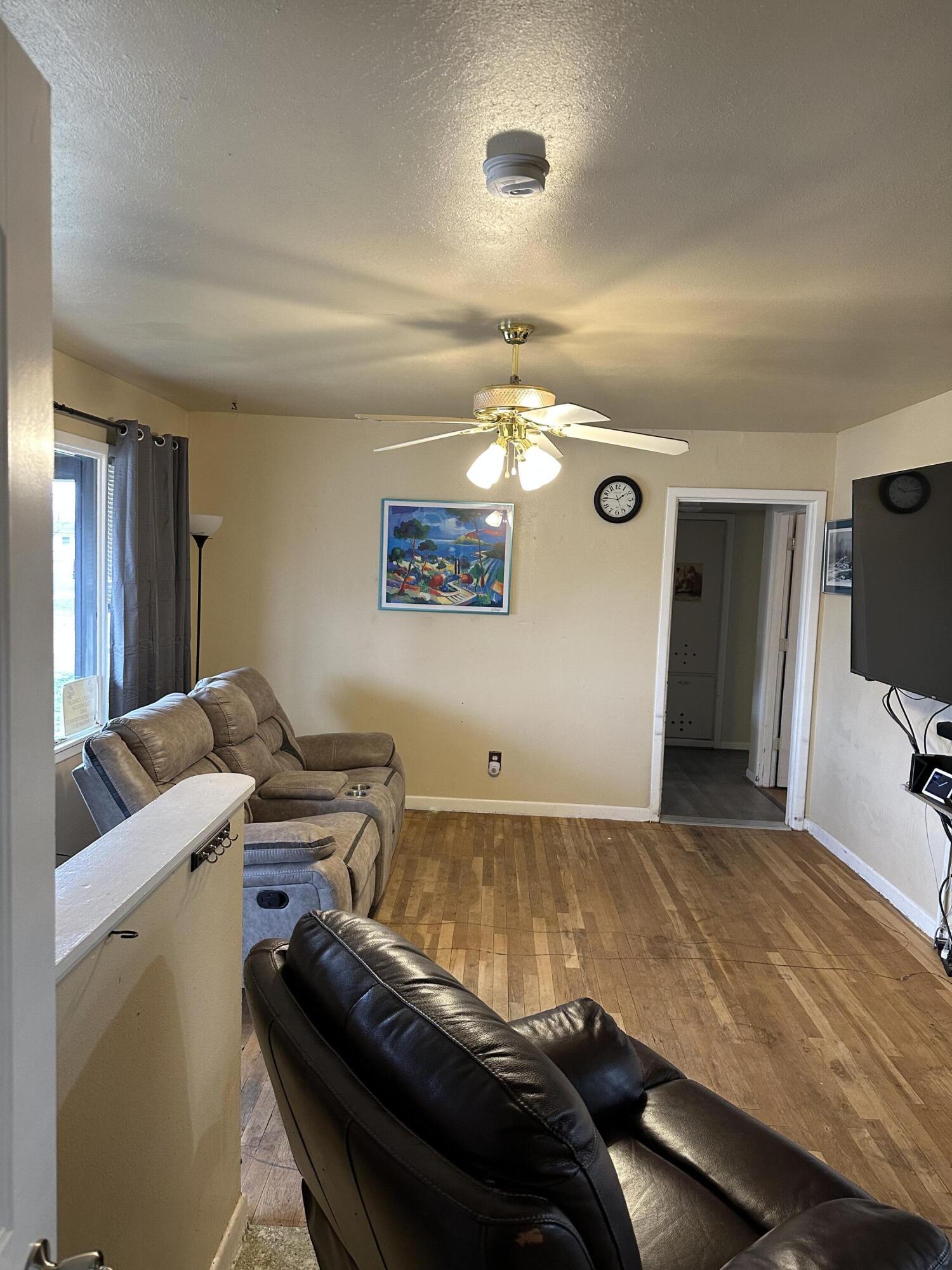 1907 38th Street Lubbock, TX 79412 - Photo 6 of 36 a bedroom with a bed and a flat screen tv