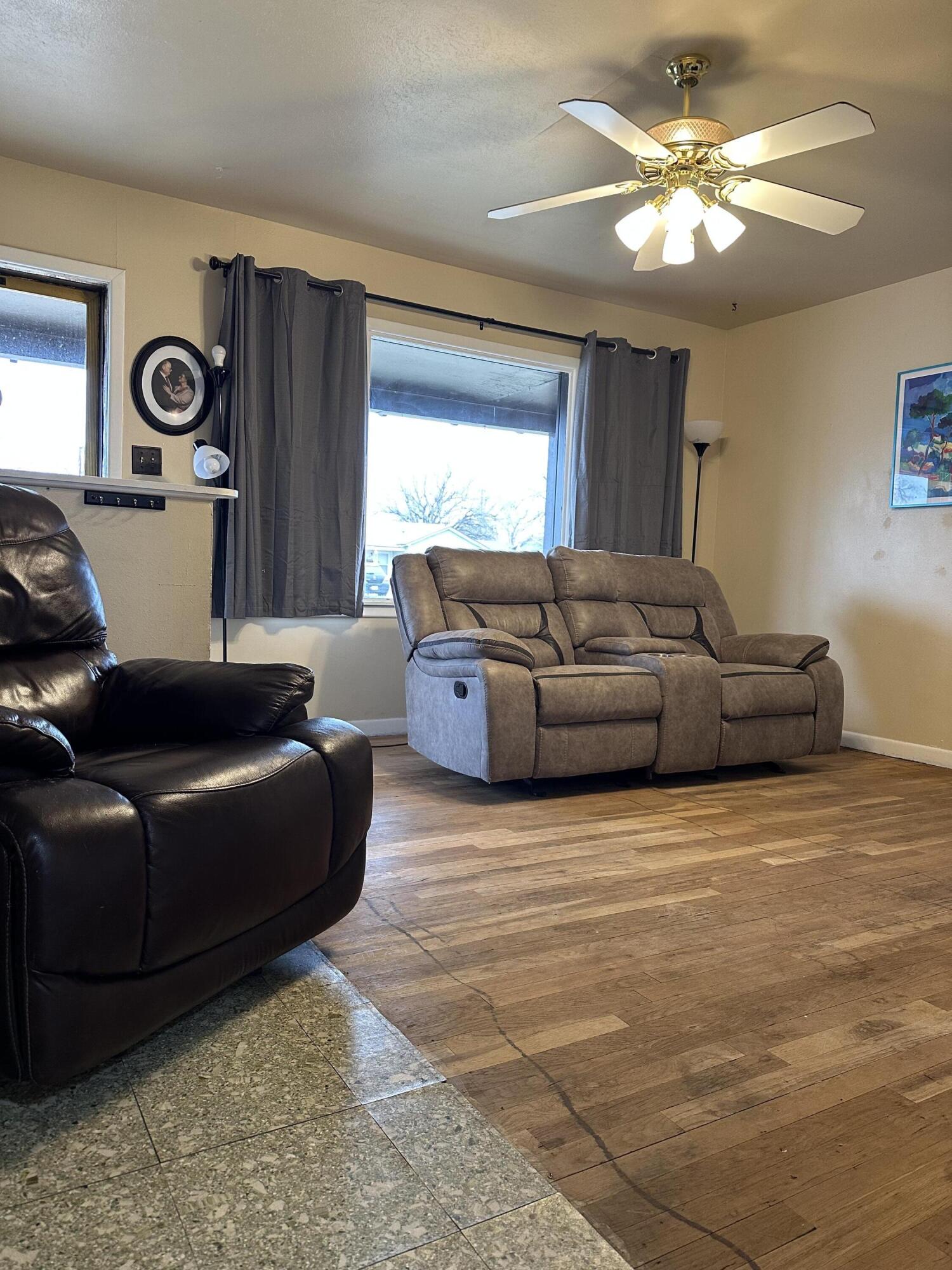 1907 38th Street Lubbock, TX 79412 - Photo 7 of 36 a living room with furniture and a window