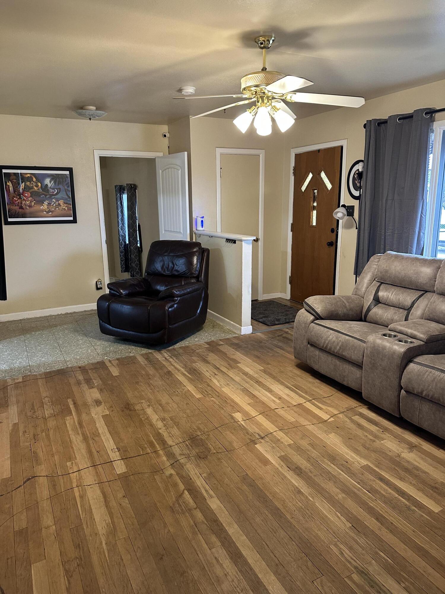 1907 38th Street Lubbock, TX 79412 - Photo 8 of 36 a living room with furniture and a mirror