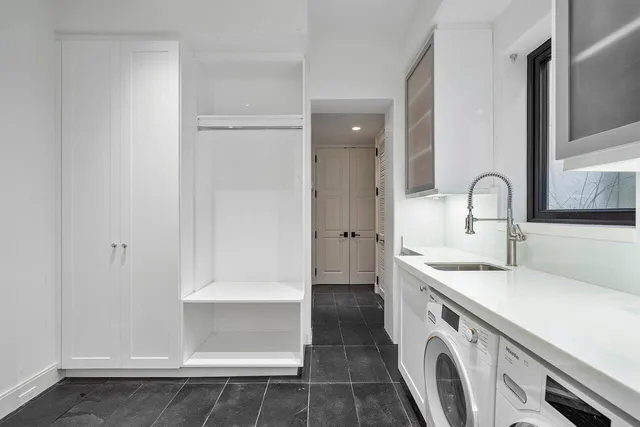 a kitchen with a sink and a stove top oven