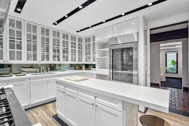 a kitchen with a sink and cabinets